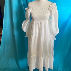 Buy2 items get1 free.3/$25 items for$50. White lined, long puffy sleeved mididre